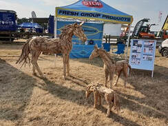 life-size driftwood horse and small driftwood horses