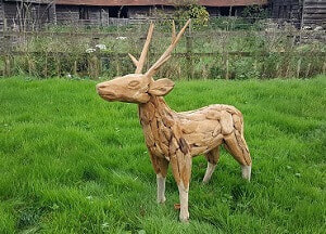 driftwood reindeer on grass