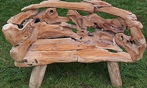 driftwood bench in the garden