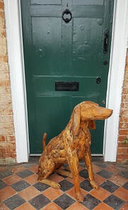 driftwood dog by front door