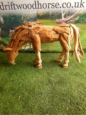 small driftwood horse drinking