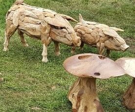 driftwood pigs and wooden mushrooms